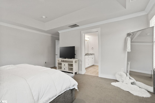 901 Whitemarsh Ave, Simpsonville, SC 29680 - carpeted bedroom featuring baseboards, ornamental molding, ensuite bathroom, visible vents, and a raised ceiling