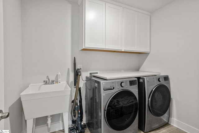 901 Whitemarsh Ave, Simpsonville, SC 29680 - laundry area featuring a sink, independent washer and dryer, baseboards, and cabinet space