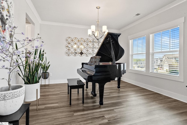 901 Whitemarsh Ave, Simpsonville, SC 29680 - living area with a notable chandelier, baseboards, ornamental molding, visible vents, and wood finished floors