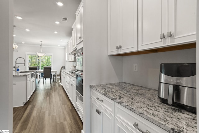 901 Whitemarsh Ave, Simpsonville, SC 29680 - kitchen with visible vents, white cabinetry, a sink, and dark wood-style floors