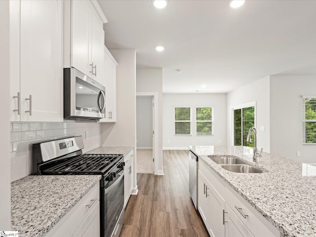 217 Merriweather Way, Spartanburg, SC 29302 - kitchen with appliances with stainless steel finishes, a sink, dark wood finished floors, white cabinetry, and recessed lighting