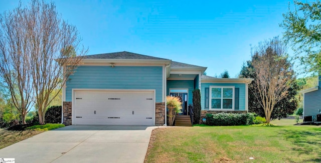 ranch-style home featuring driveway, stone siding, a garage, and a front lawn