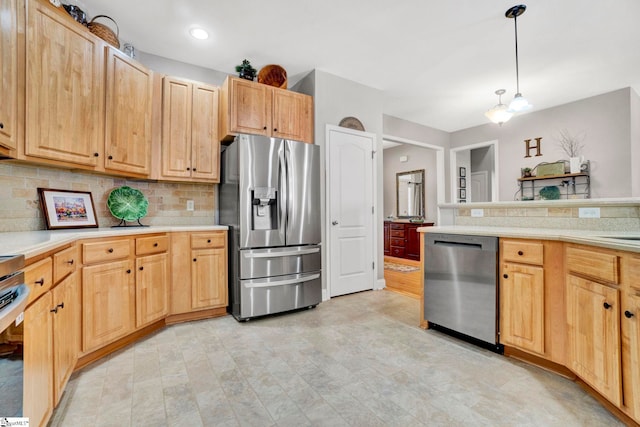 kitchen featuring light countertops, decorative backsplash, light brown cabinets, and stainless steel appliances