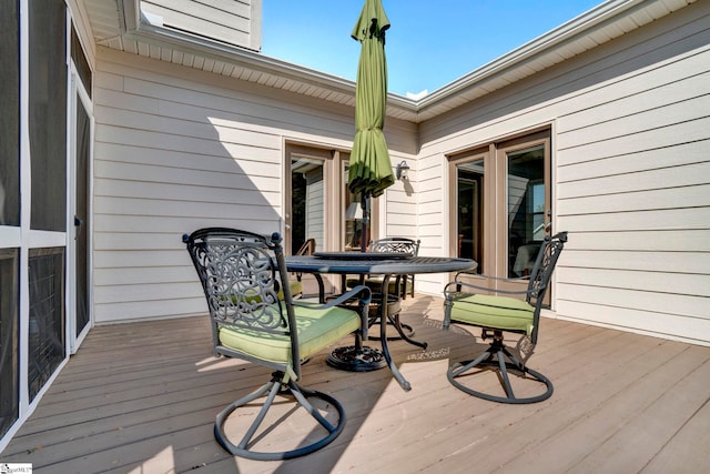 wooden deck with outdoor dining space