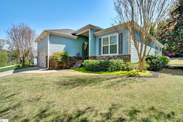 ranch-style home with an attached garage, a front lawn, stone siding, and driveway