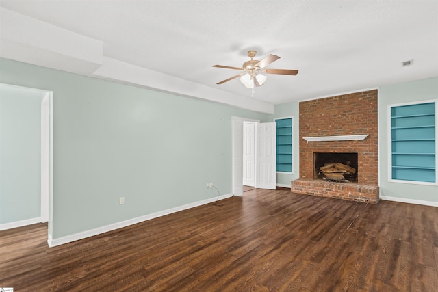 unfurnished living room featuring built in features, a ceiling fan, visible vents, wood finished floors, and baseboards