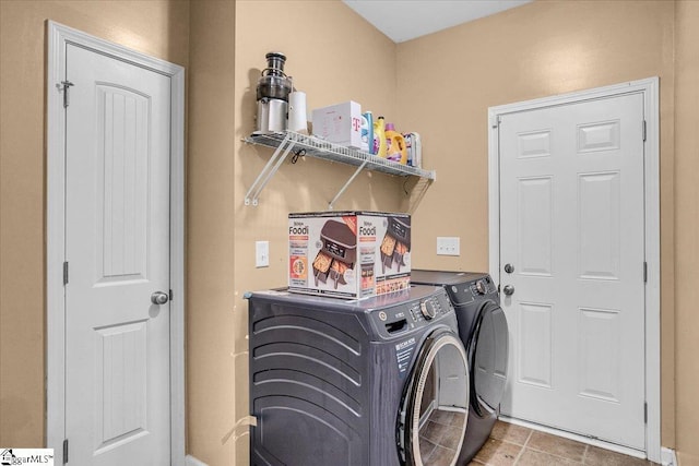 laundry room featuring independent washer and dryer, laundry area, and tile patterned floors