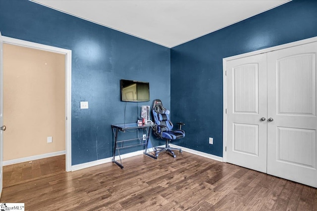 office with baseboards and wood finished floors