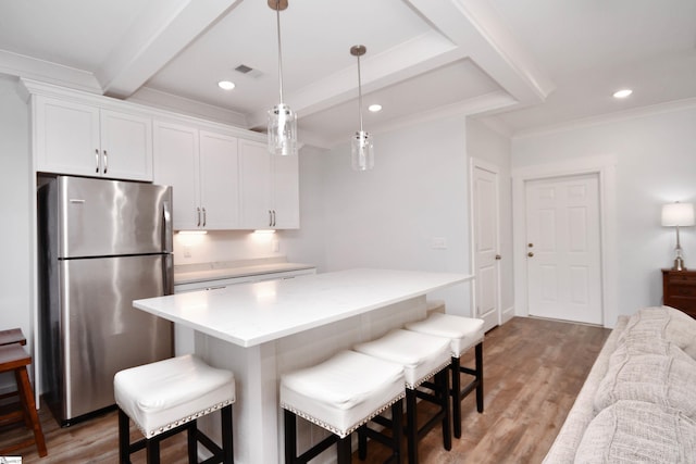 1337 Millrock Church Rd, Gray Court, SC 29645 - kitchen with light countertops, freestanding refrigerator, white cabinets, visible vents, and beamed ceiling
