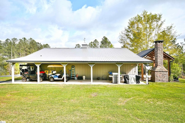 1337 Millrock Church Rd, Gray Court, SC 29645 - rear view of house with a carport, a yard, metal roof, and a chimney