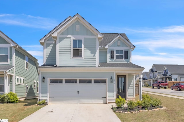 309 Townsend Ave, Greer, SC 29651 - view of front of home with board and batten siding, driveway, and a garage
