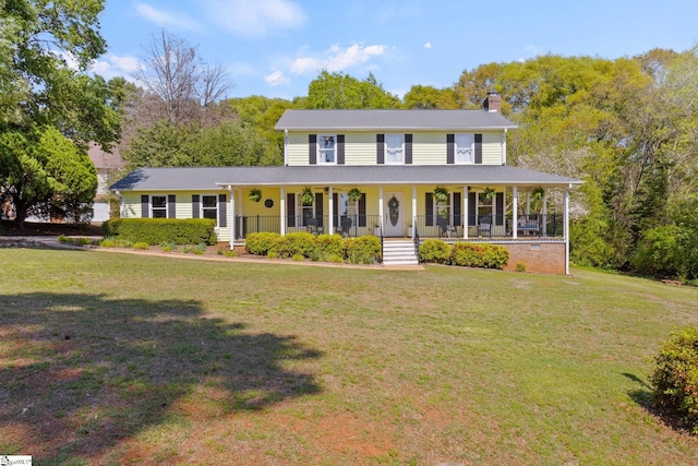 view of front of property with a porch, a chimney, and a front yard