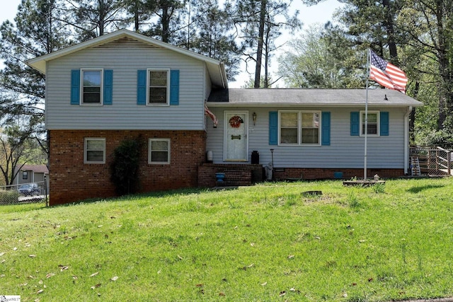 407 Rotterdam Rd, Easley, SC 29640 - split level home featuring a front yard, fence, and brick siding