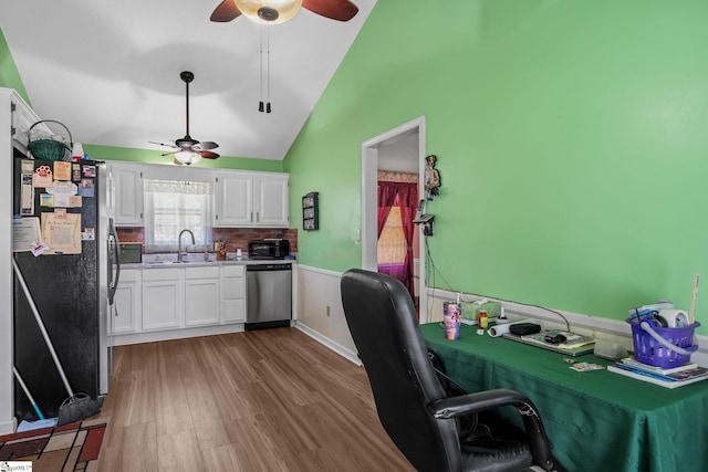 407 Rotterdam Rd, Easley, SC 29640 - kitchen featuring lofted ceiling, white cabinetry, a ceiling fan, and appliances with stainless steel finishes