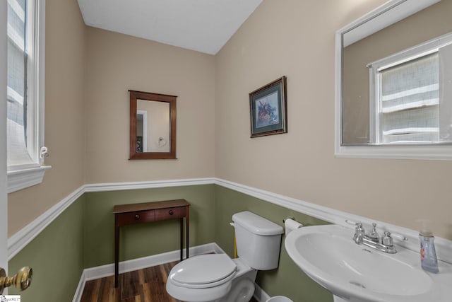 407 Rotterdam Rd, Easley, SC 29640 - half bathroom featuring a sink, toilet, wood finished floors, and baseboards