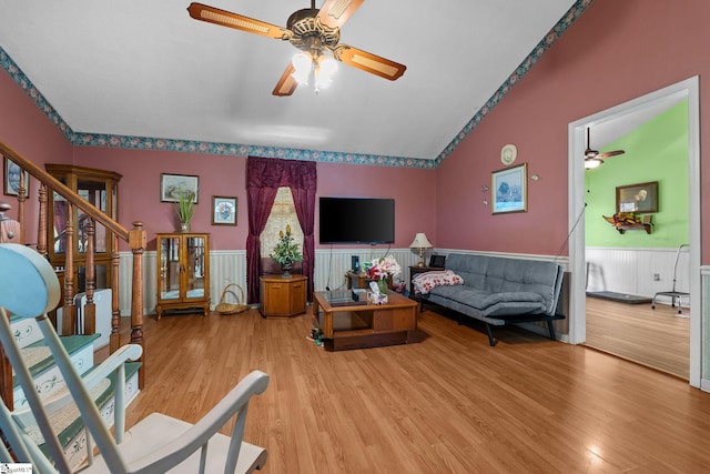 407 Rotterdam Rd, Easley, SC 29640 - living room with ceiling fan, vaulted ceiling, wood finished floors, wainscoting, and stairs