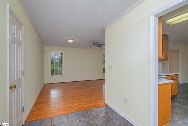 15 Red Cedar Ct, Simpsonville, SC 29681 - empty room with a textured ceiling, wood finished floors, baseboards, and a ceiling fan