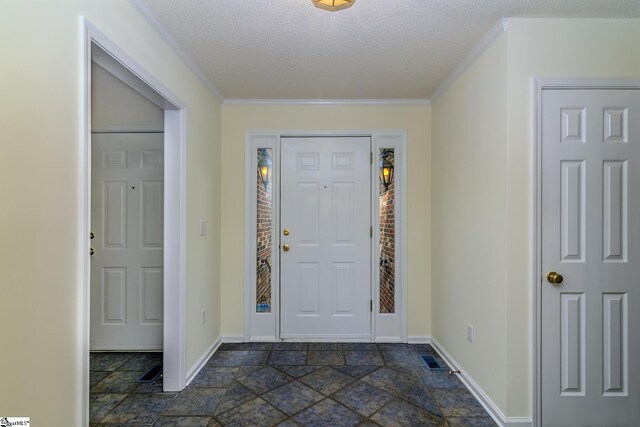 15 Red Cedar Ct, Simpsonville, SC 29681 - entrance foyer featuring crown molding, a textured ceiling, visible vents, stone finish flooring, and baseboards