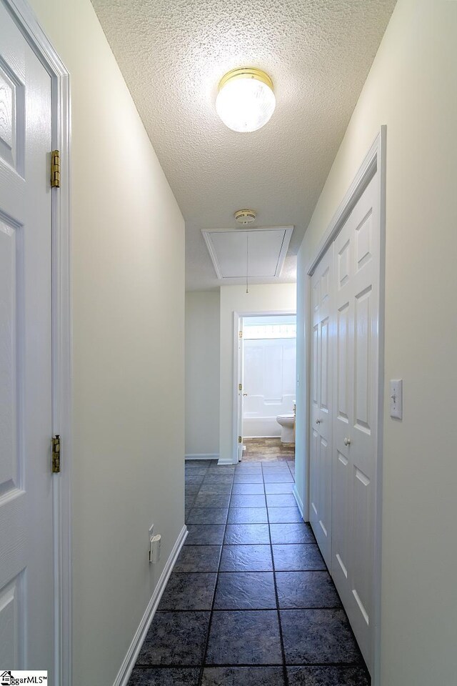15 Red Cedar Ct, Simpsonville, SC 29681 - hallway with baseboards, attic access, and a textured ceiling
