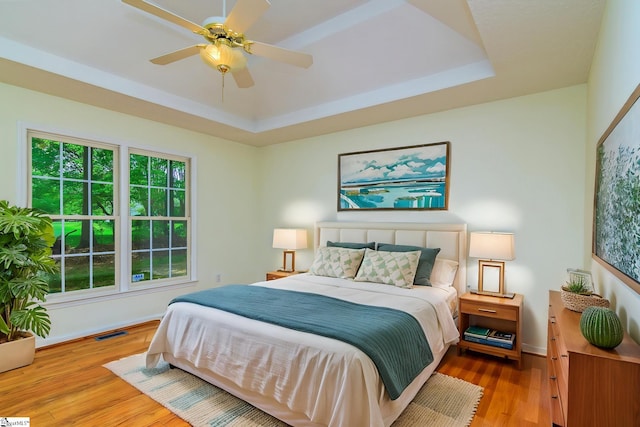 15 Red Cedar Ct, Simpsonville, SC 29681 - bedroom with visible vents, baseboards, a raised ceiling, and wood finished floors