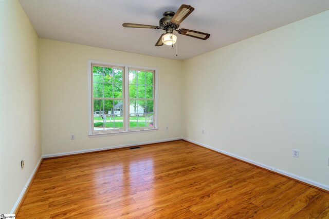 15 Red Cedar Ct, Simpsonville, SC 29681 - spare room with ceiling fan, visible vents, baseboards, and wood finished floors
