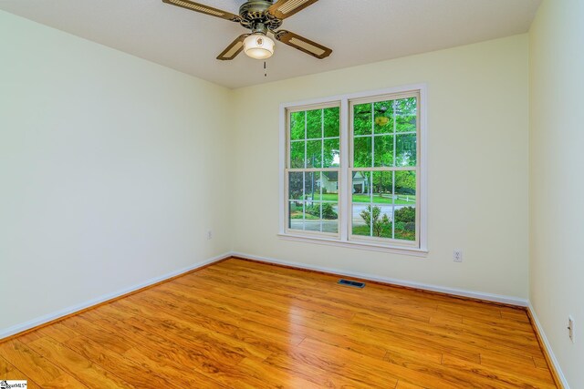 15 Red Cedar Ct, Simpsonville, SC 29681 - unfurnished room with visible vents, ceiling fan, wood finished floors, and baseboards