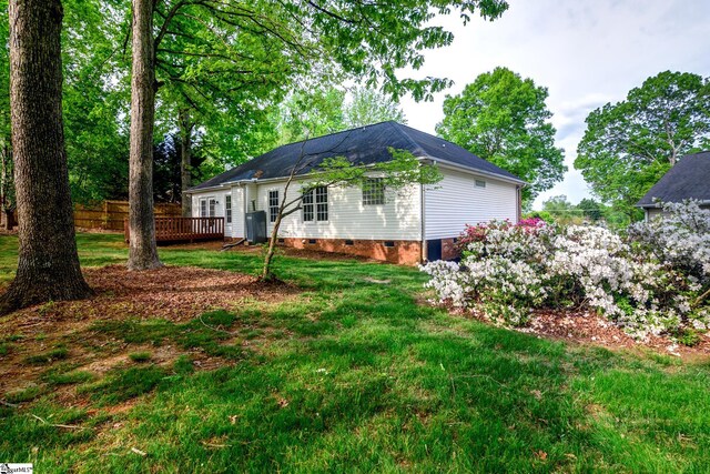 15 Red Cedar Ct, Simpsonville, SC 29681 - exterior space featuring crawl space, a shingled roof, a yard, and a wooden deck