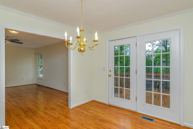 15 Red Cedar Ct, Simpsonville, SC 29681 - interior space featuring a textured ceiling, light wood finished floors, ornamental molding, and visible vents