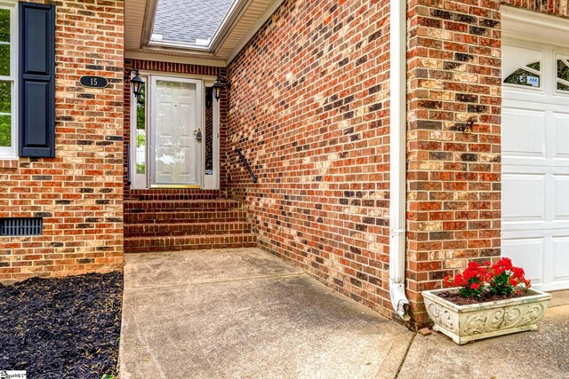 15 Red Cedar Ct, Simpsonville, SC 29681 - property entrance with a garage and brick siding