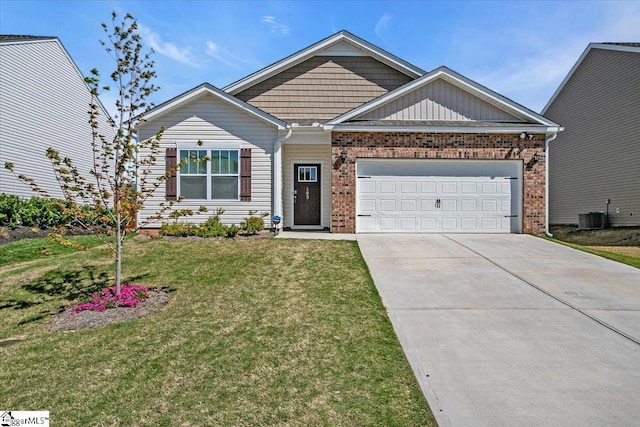 103 Slateford Cir, Piedmont, SC 29673 - craftsman-style house with a garage, central air condition unit, a front yard, brick siding, and concrete driveway