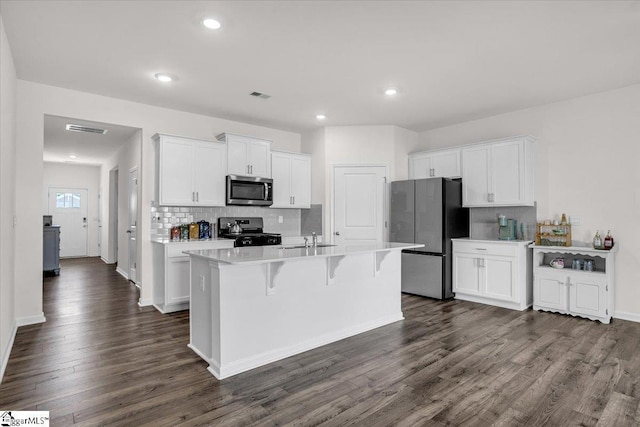 103 Slateford Cir, Piedmont, SC 29673 - kitchen with white cabinets, visible vents, appliances with stainless steel finishes, dark wood-style flooring, and a sink