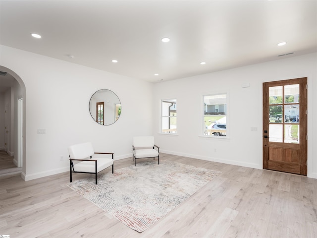 242 Queensbury Way, Spartanburg, SC 29302 - unfurnished room with visible vents, baseboards, arched walkways, light wood finished floors, and recessed lighting