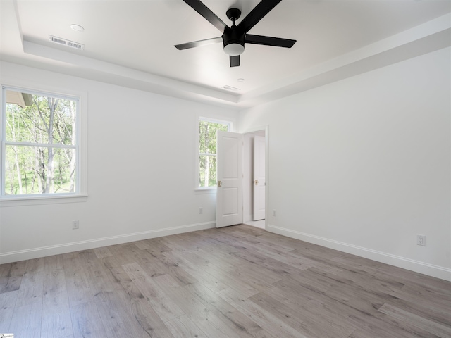 242 Queensbury Way, Spartanburg, SC 29302 - empty room with visible vents, baseboards, a raised ceiling, ceiling fan, and wood finished floors
