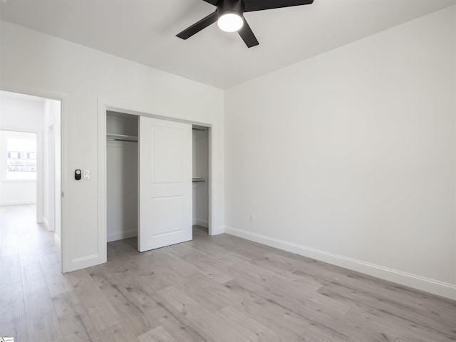 242 Queensbury Way, Spartanburg, SC 29302 - unfurnished bedroom with a closet, baseboards, light wood finished floors, and ceiling fan