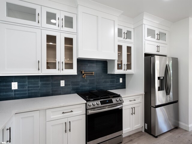 242 Queensbury Way, Spartanburg, SC 29302 - kitchen featuring white cabinetry, appliances with stainless steel finishes, and light wood-style floors