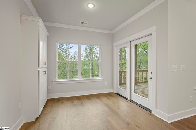 47 Park Vista Way, Greenville, SC 29617 - doorway with ornamental molding, visible vents, light wood-type flooring, and plenty of natural light