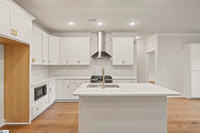 47 Park Vista Way, Greenville, SC 29617 - kitchen featuring wall chimney exhaust hood, visible vents, light countertops, a sink, and built in microwave