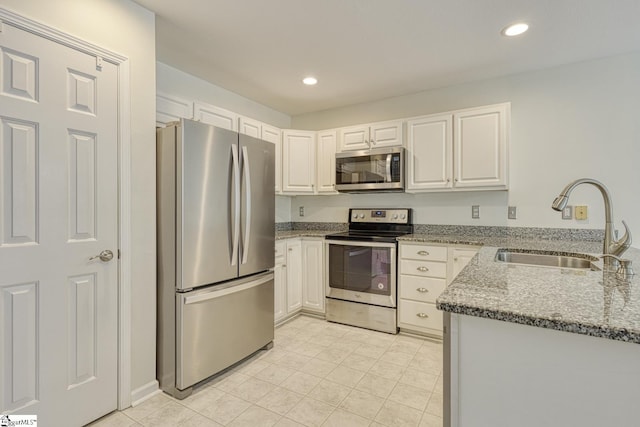 611 Grover Dr, Lyman, SC 29365 - kitchen featuring stone counters, recessed lighting, white cabinetry, appliances with stainless steel finishes, and a sink
