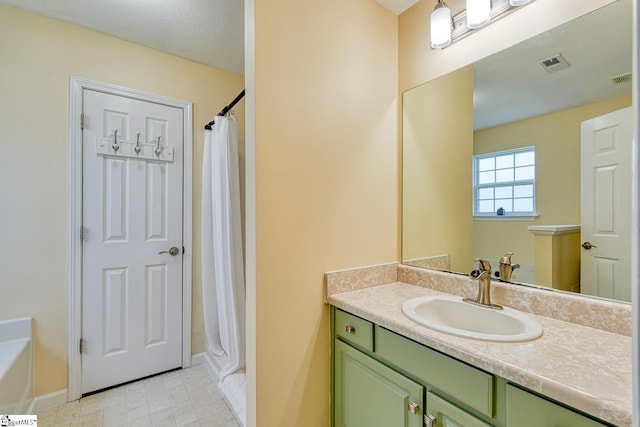 611 Grover Dr, Lyman, SC 29365 - bathroom featuring vanity, visible vents, curtained shower, baseboards, and a bathtub