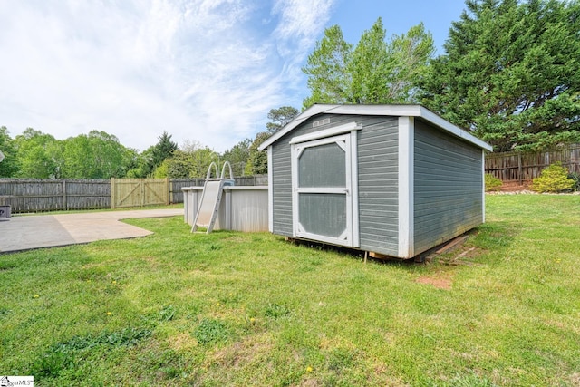 611 Grover Dr, Lyman, SC 29365 - view of shed with a swimming pool and a fenced backyard