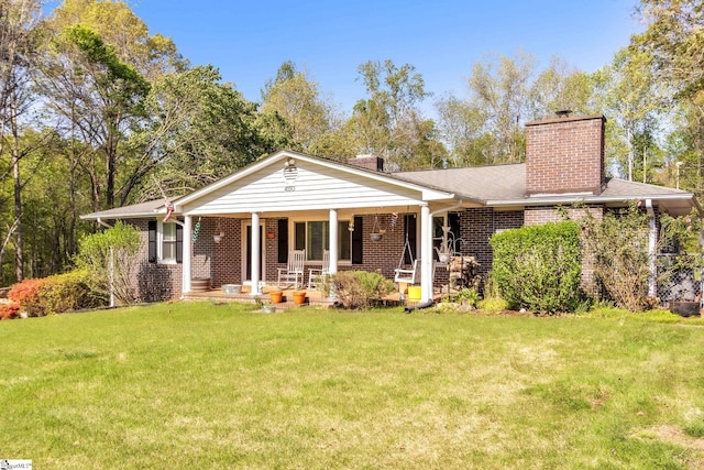 4150 Sandy Flat Rd, Taylors, SC 29687 - view of front of home featuring a shingled roof, covered porch, a chimney, brick siding, and a front lawn