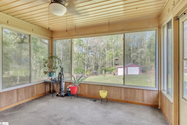 4150 Sandy Flat Rd, Taylors, SC 29687 - sunroom featuring visible vents, a ceiling fan, carpet flooring, and wood walls