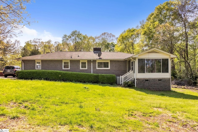 4150 Sandy Flat Rd, Taylors, SC 29687 - back of house featuring roof with shingles, a chimney, crawl space, brick siding, and a yard