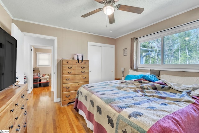 4150 Sandy Flat Rd, Taylors, SC 29687 - bedroom with ornamental molding, light wood finished floors, a closet, and a ceiling fan