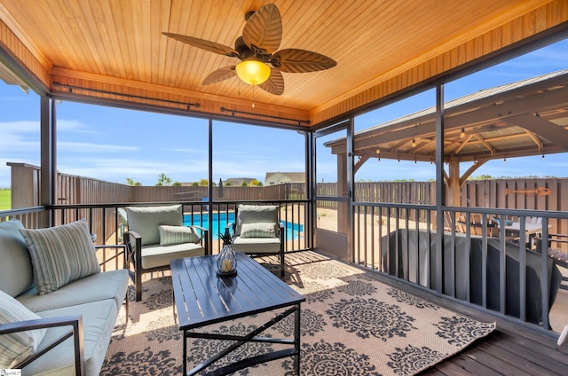 sunroom / solarium with outdoor lounge area and ceiling fan