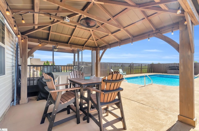view of swimming pool with a fenced backyard, a patio area, and a gazebo