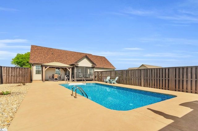 view of pool with a gazebo, a patio, and a fenced backyard