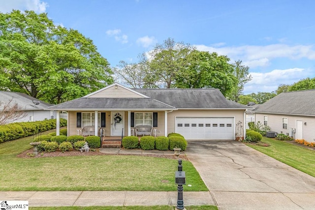 view of front of property with a front yard, a porch, and an attached garage