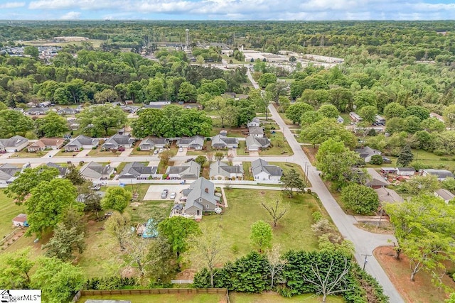 aerial view featuring a residential view and a view of trees