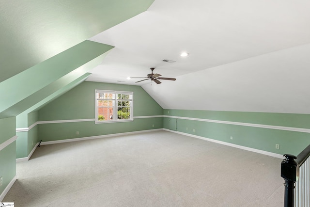 bonus room featuring visible vents, baseboards, a ceiling fan, and vaulted ceiling